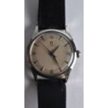 A 1970S GENTLEMANS OMEGA WRISTWATCH with black leather strap. 1.5ins diameter.