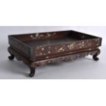 A 19TH CENTURY CHINESE CARVED HONGMU AND MOTHER OF PEARL TABLE ON STAND decorated with figures,