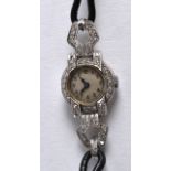 A 1930S LADIES 9CT WHITE GOLD LADIES COCKTAIL WATCH. 1.25ins long.