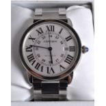 A GOOD CARTIER AUTOMATIC STAINLESS STEEL WRISTWATCH in original box with papers. Dial 1.75ins