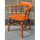 A 19TH CENTURY ASH SMOKERS CHAIR with yoke back.