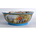A LARGE 19TH CENTURY SEVRES PORCELAIN BOWL painted with a scene of figures within a landscape. 10Ins