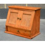 A SMALL PINE TWO DOOR TABLE CABINET.