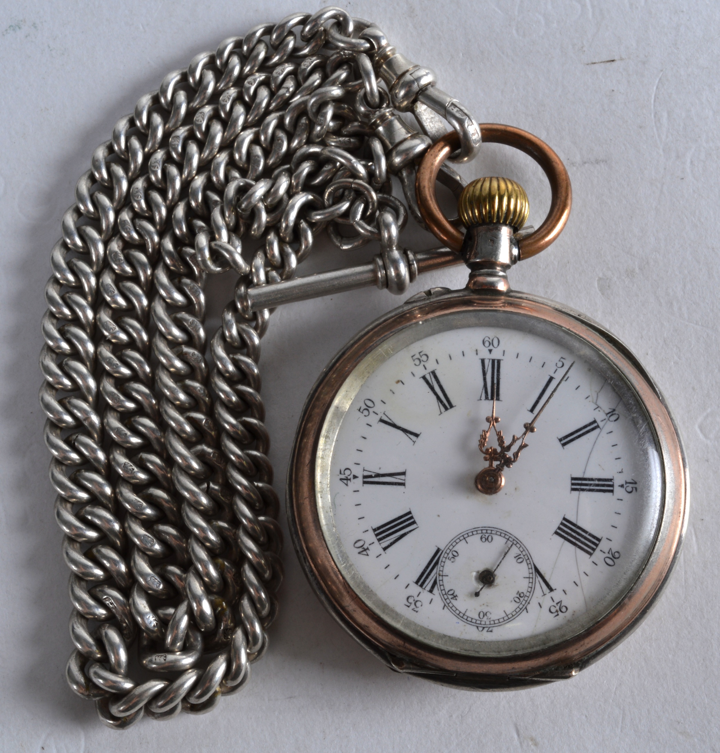 A LATE 19TH CENTURY CONTINENTAL SILVER POCKET WATCH with attached silver chain, the case decorated