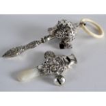 A VICTORIAN SILVER AND IVORY BABIES TEETHING RATTLE together with another smaller rattle. (2)