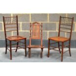 A PAIR OF EDWARDIAN BAMBOO EFFECT SINGLE CHAIRS together with a folding chair. (3)