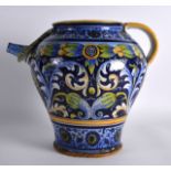 A MID 19TH CENTURY ITALIAN FAIENCE GLAZED POTTERY EWER painted with flowers and scrolling vines.