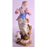 A MID 19TH CENTURY MEISSEN PORCELAIN FIGURE OF A FEMALE modelled standing beside a lamb, upon a