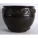 A GOOD 17TH CENTURY CHINESE BRONZE JARDINIERE Ming, bearing Xuande marks to base, decorated in