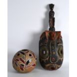 AN UNUSUAL CARVED AND POLYCHROMED TRIBAL MASK together with a pottery jarlet. (2)