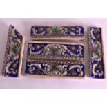 A GROUP OF FIVE PERSIAN TILE FRAGMENTS of rectangular form, painted with flowers. 10Ins wide. (5)