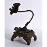 A LATE 19TH CENTURY JAPANESE MEIJI PERIOD BRONZE GROUP depicting toads beside a naturalistic