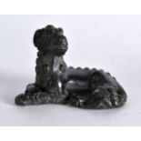 A CHINESE SILVERED BRONZE SCROLL WEIGHT in the form of a recumbent beast. 2.75ins wide.