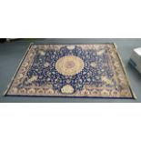 A BLUE GROUND KESHAN CARPET. 2.8m x 2m.