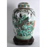 A GOOD MID 19TH CENTURY CHINESE FAMILLE VERTE GINGER JAR AND COVER bearing Qianlong mark to base,