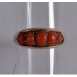 AN EDWARDIAN 9CT YELLOW GOLD AND CORAL LADIES RING.