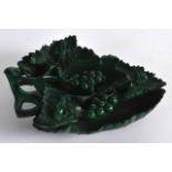 AN EARLY 20TH CENTURY CHINESE CARVED MALACHITE BRUSH WASHER of naturalistic form. 5.25ins wide.