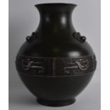 A GOOD 18TH CENTURY CHINESE BRONZE HU VASE silver inlaid with archaic style motifs, with mask head