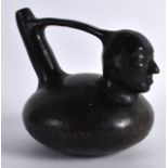 A SOUTH AMERICAN POTTERY VESSEL of figural form and painted in black. 5.5ins wide.