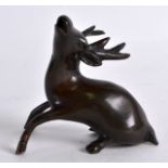 AN 18TH CENTURY CHINESE BRONZE WATER DROPPER in the form of a stag, modelled recumbent with legs