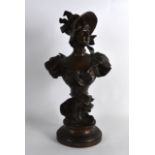 AN ART NOUVEAU FRENCH BRONZE FIGURE OF A FEMLE modelled in ruffled clothing, upon a circular stepped