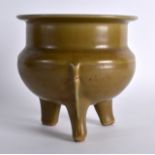 A 19TH CENTURY CHINESE GREEN CELADON CENSER in the Ming style, supported upon three tripod feet. 5.