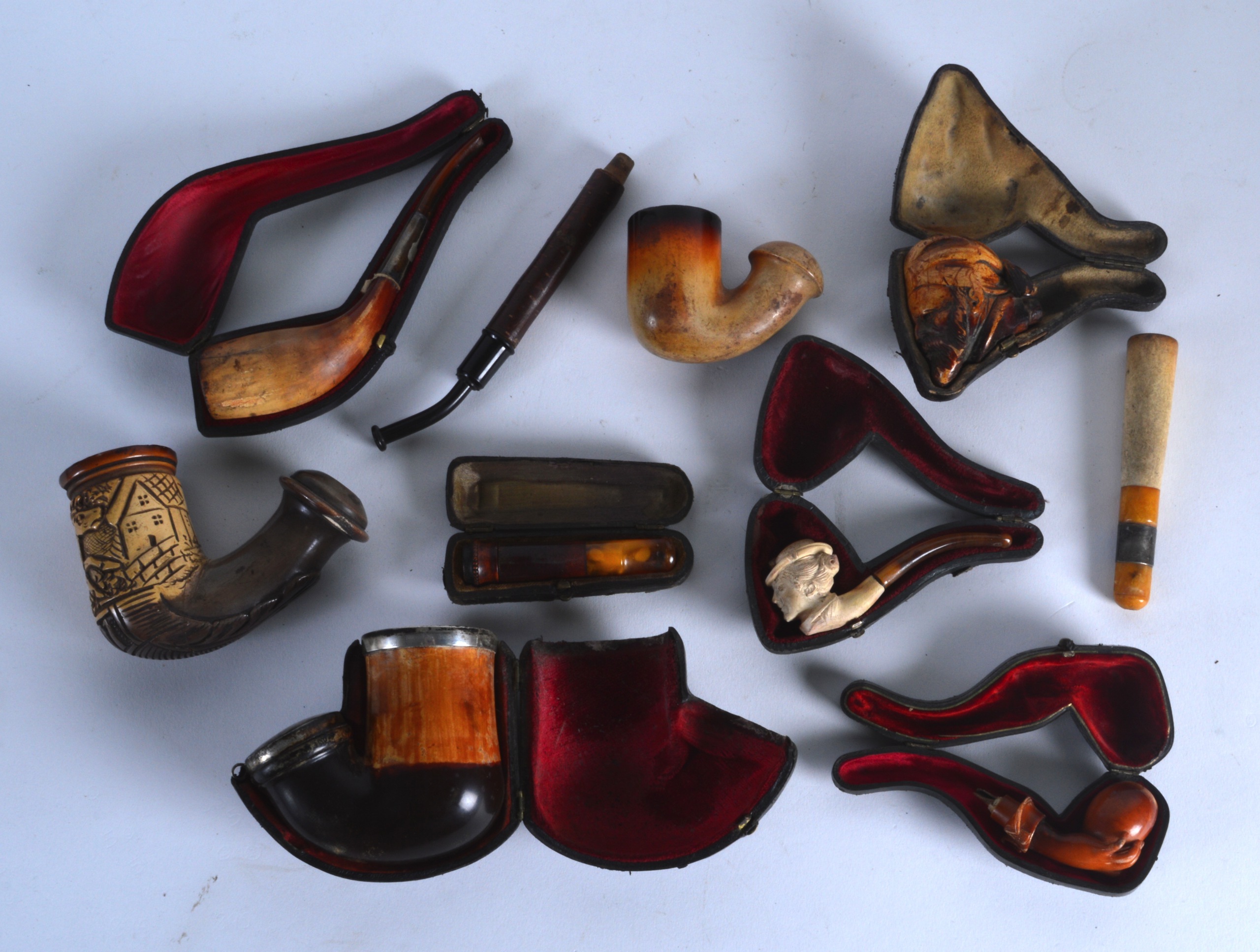 A COLLECTION OF ANTIQUE MEERSCHAUM AND OTHER PIPES mostly contained within leather cases. (qty)