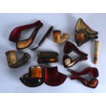A COLLECTION OF ANTIQUE MEERSCHAUM AND OTHER PIPES mostly contained within leather cases. (qty)
