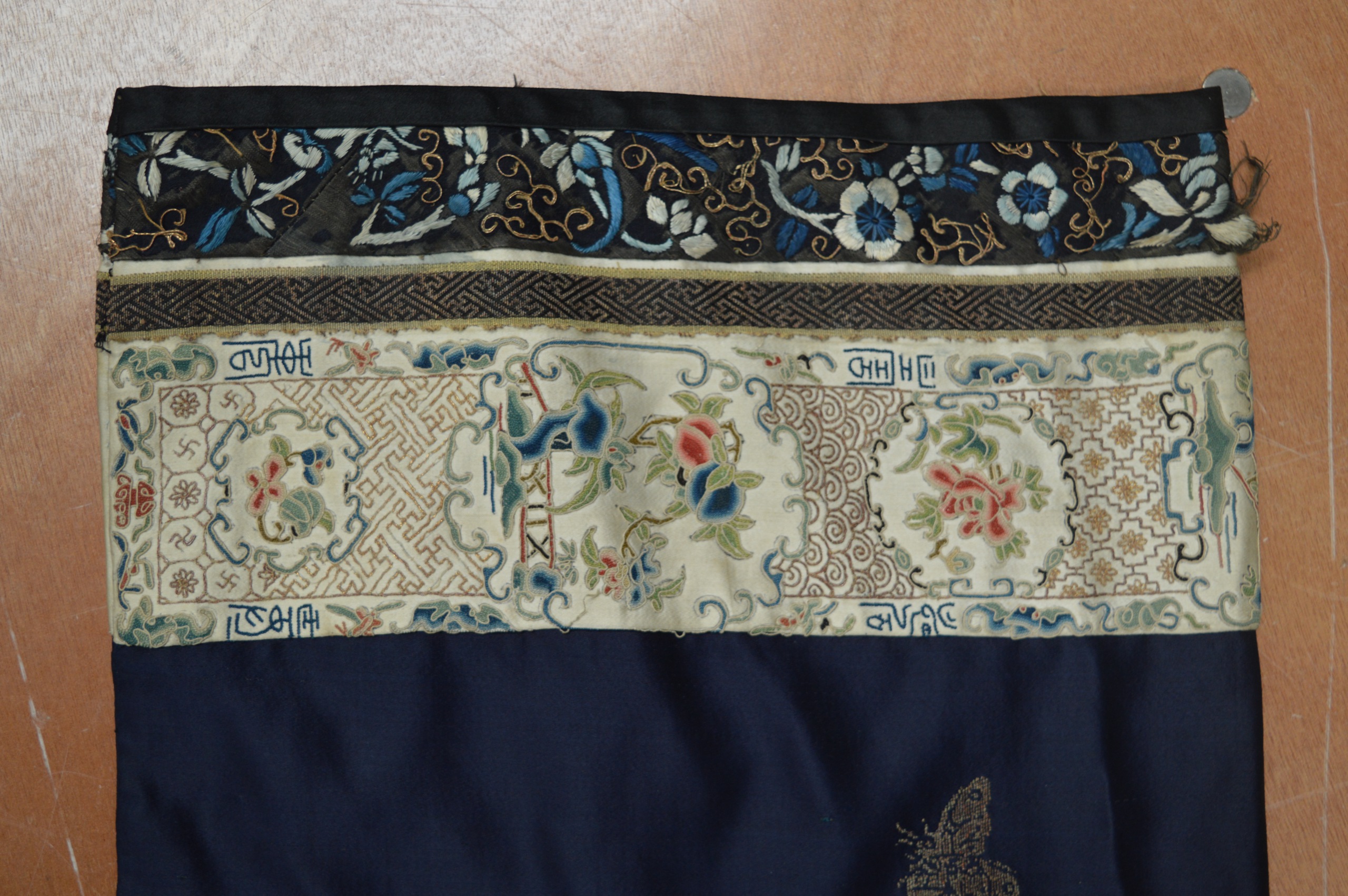 AN UNUSUAL 19TH CENTURY CHINESE BLUE SILKWORK ROBE decorated with insects and landscapes, the - Image 7 of 8