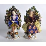 A PAIR OF LATE 19TH CENTURY CONTINENTAL FIGURES modelled upon scrolling rococo bases. 7.5ins high.