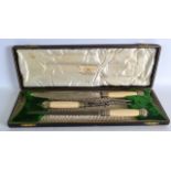 A CASED SET OF LATE VICTORIAN STEEL AND IVORY SERVING TOOLS.