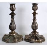 A PAIR OF 19TH CENTURY RUSSIAN SILVER CANDLESTICKS modelled upon shell shaped bases. Stamped CAS & B