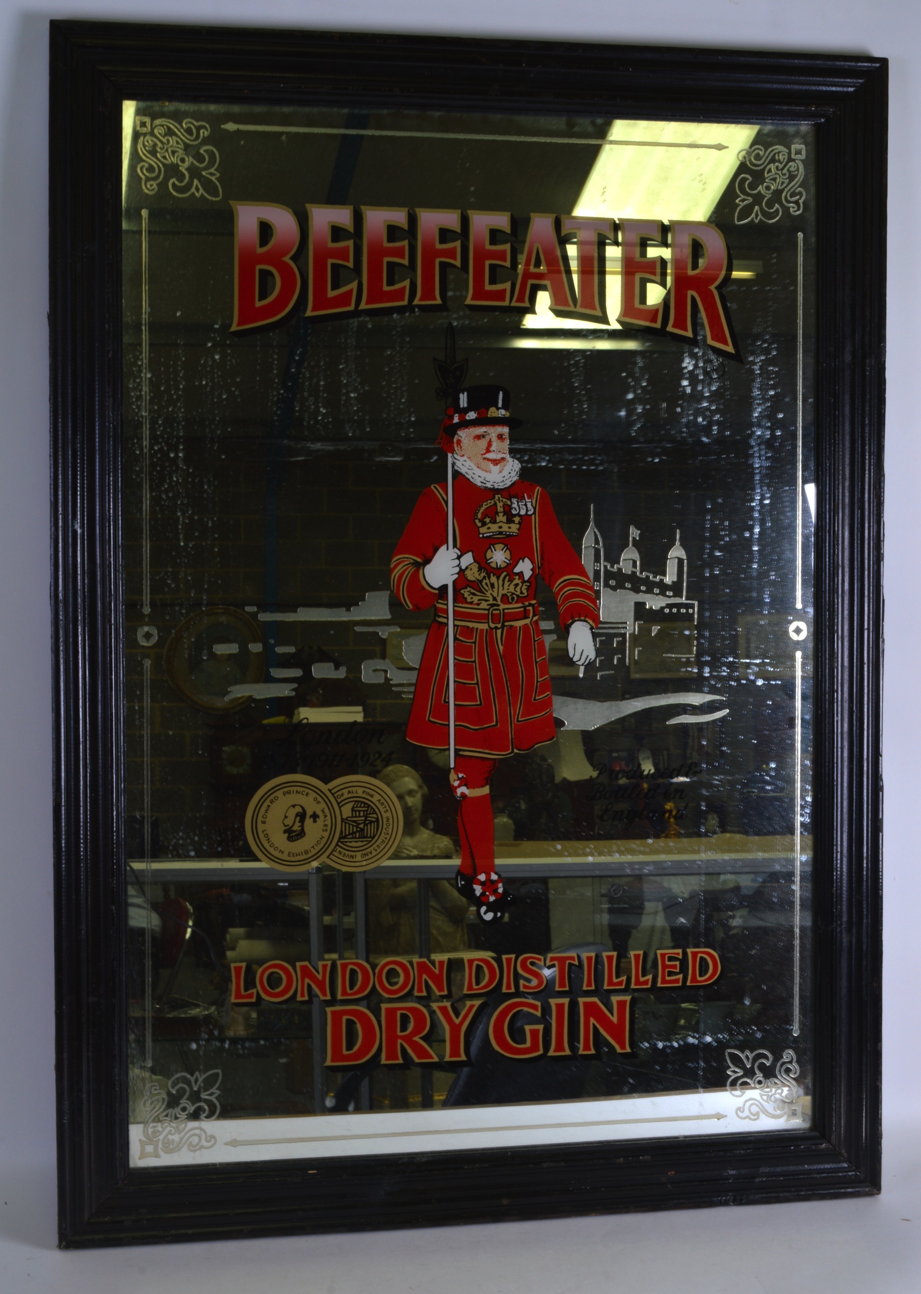 A LARGE VINTAGE FRAMED ADVERTISING 'BEEFEATER GIN' MIRROR. 3Ft x 2ft 2ins.