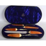 A CASED VICTORIAN MAPPIN AND WEBB IVORY HANDLED CARVING SET with hallmarked silver collars, within a