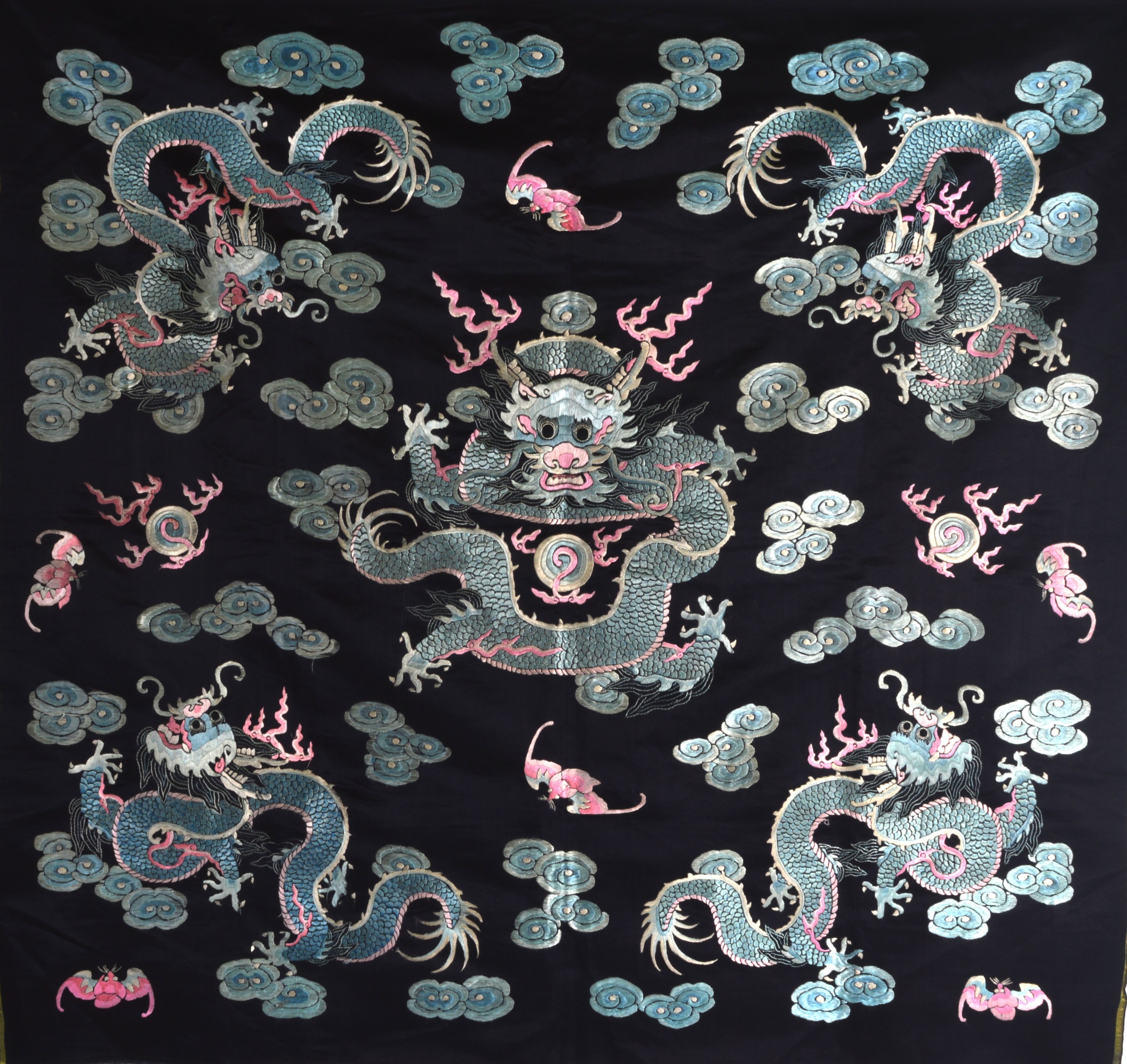 A 19TH CENTURY CHINESE BLUE SILKWORK RECTANGULAR PANEL decorated with a central five claw dragon