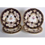 A SET OF FOUR EARLY 20TH CENTURY ROYAL CROWN DERBY PLATES painted with flowers on a blue ground. 8.