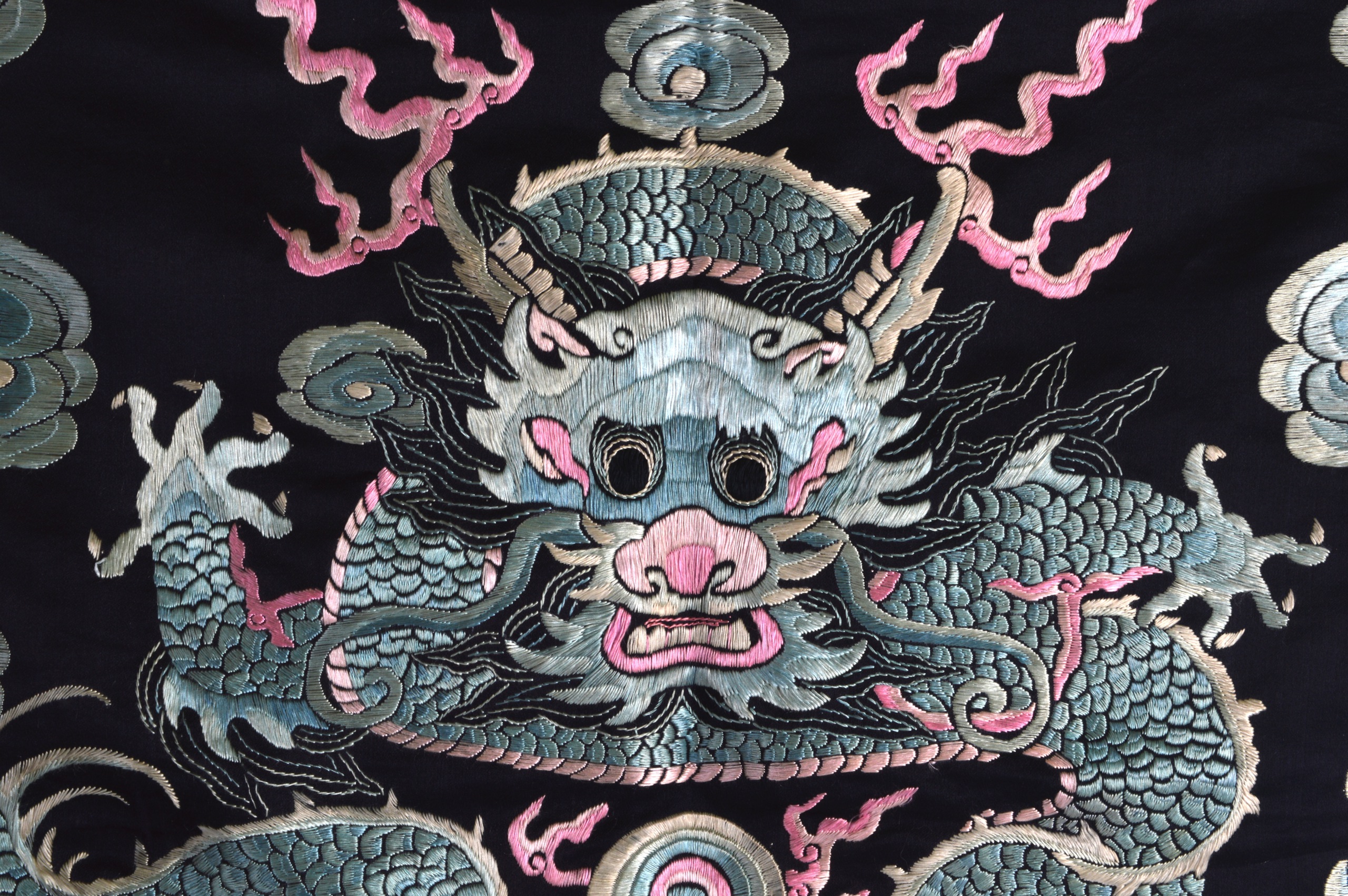A 19TH CENTURY CHINESE BLUE SILKWORK RECTANGULAR PANEL decorated with a central five claw dragon - Image 2 of 3