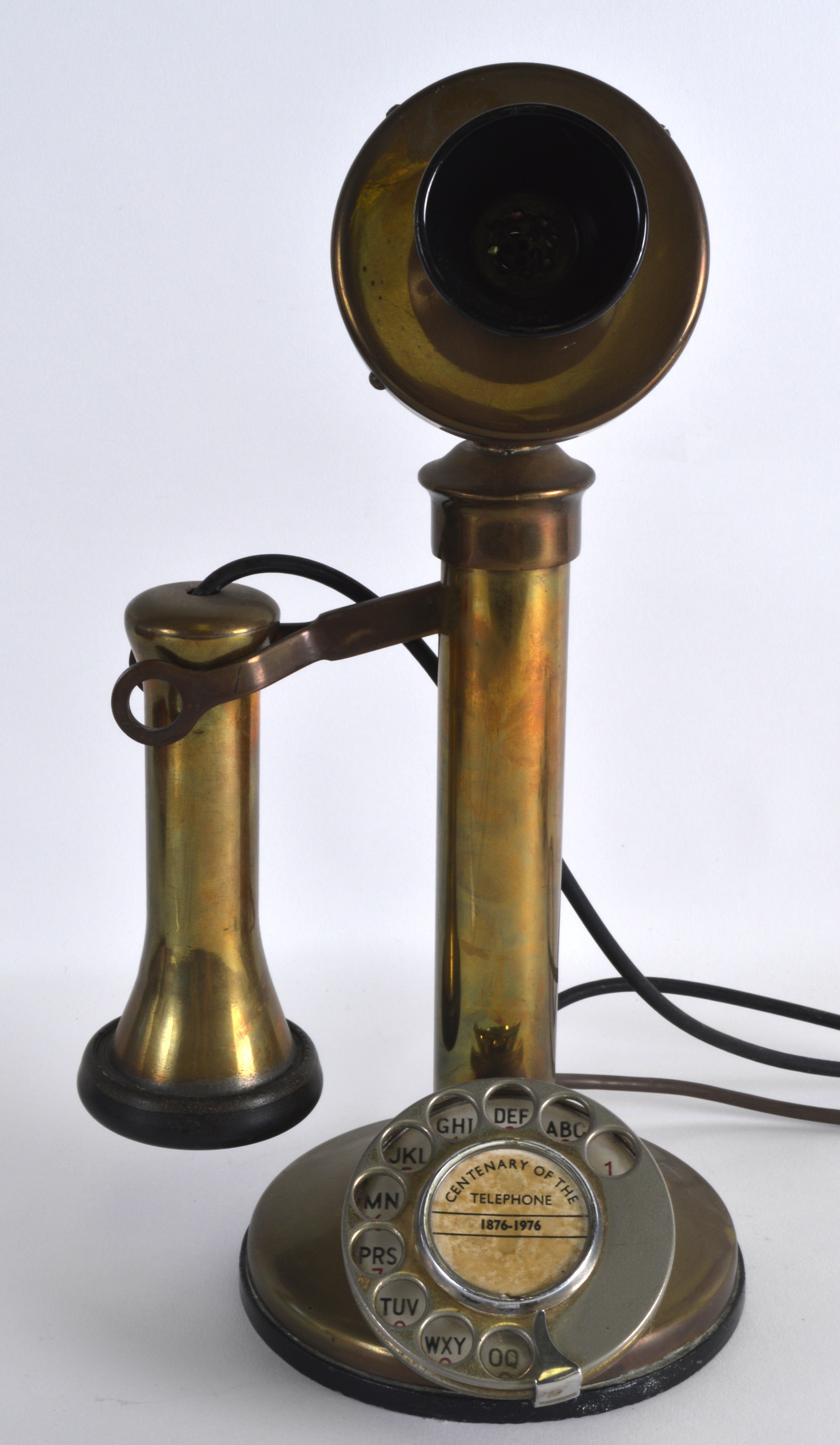 A VINTAGE BRASS TELEPHONE. 1Ft 1ins high.