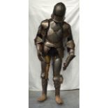 A LOVELY LATE VICTORIAN SUIT OF ARMOUR contained upon a good quality mannequin. 5Ft 10ins high.