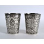 A FINE PAIR OF EARLY 19TH CENTURY INDIAN SILVER BEAKERS well decorated all over with figures,