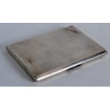 AN ART DECO ENGINE TURNED SILVER CIGARETTE CASE C1936. 4.25ins wide.