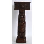 AN UNUSUAL EARLY 20TH CENTURY CARVED WOOD TOTEM POLE. 1Ft 2.5ins high.