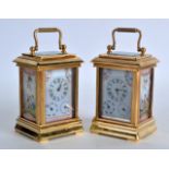 A SMALL PAIR OF MINIATURE FRENCH BRASS CARRIAGE CLOCKS inset with later Sevres style pink panels,