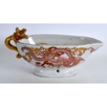 A GOOD JAPANESE EDO PERIOD PORCELAIN SAUCEBOAT painted in iron red and gilt with dragons and