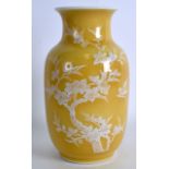 A CHINESE YELLOW GROUND PORCELAIN VASE 20th Century, painted with birds in flight amongst foliage.
