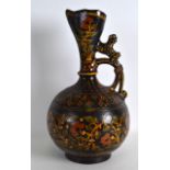 A 19TH CENTURY INDIAN TREACLE GLAZED EWER painted with flowers and vines. 12.5ins high.