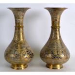 A PAIR OF 19TH CENTURY ISLAMIC SILVER COPPER AND BRASS VASES decorated with flowers. 8.75ins high.
