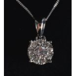 A 9CT GOLD DIAMOND DROP NECKLACE.