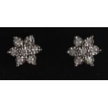 A PAIR OF 9CT GOLD AND DIAMOND CLUSTER EARRINGS.