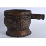 AN UNUSUAL 19TH CENTURY COPPER BOWL with embossed handle. 9.25ins wide.